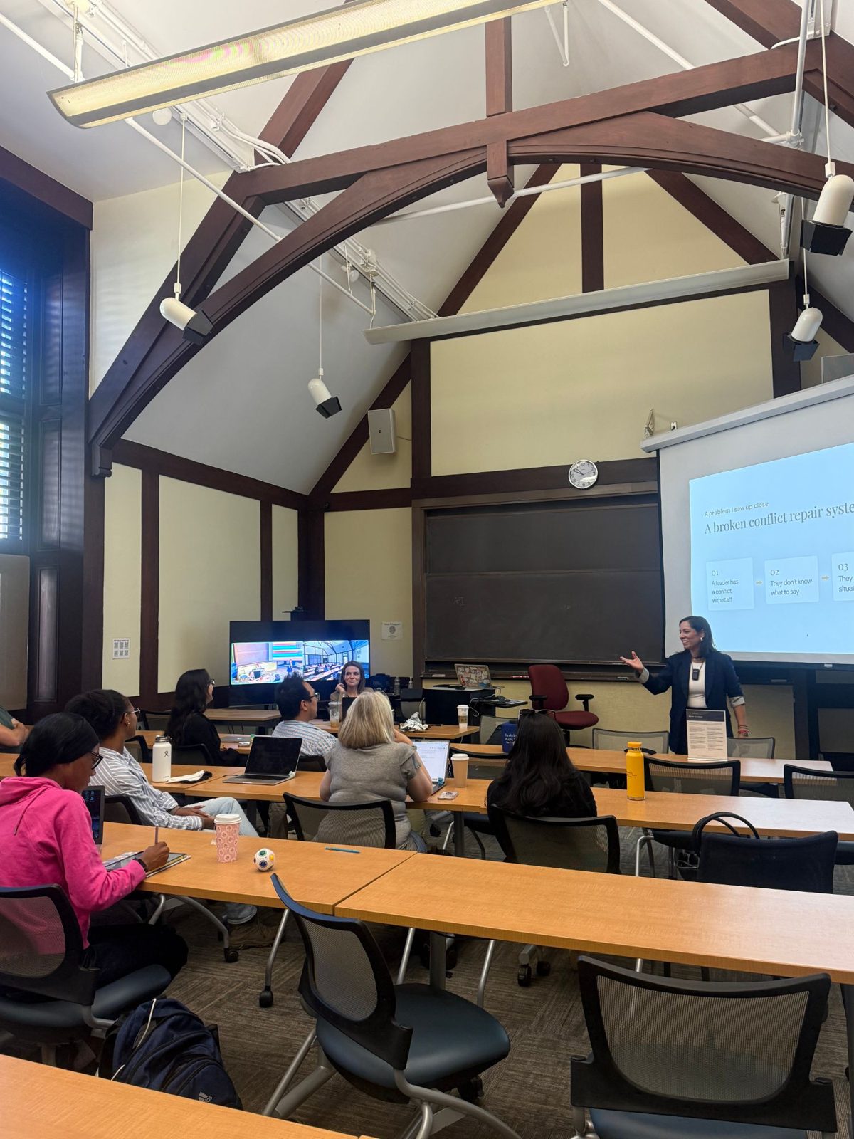 Dr. Isa Karabed teaching a university classroom about repairing conflict