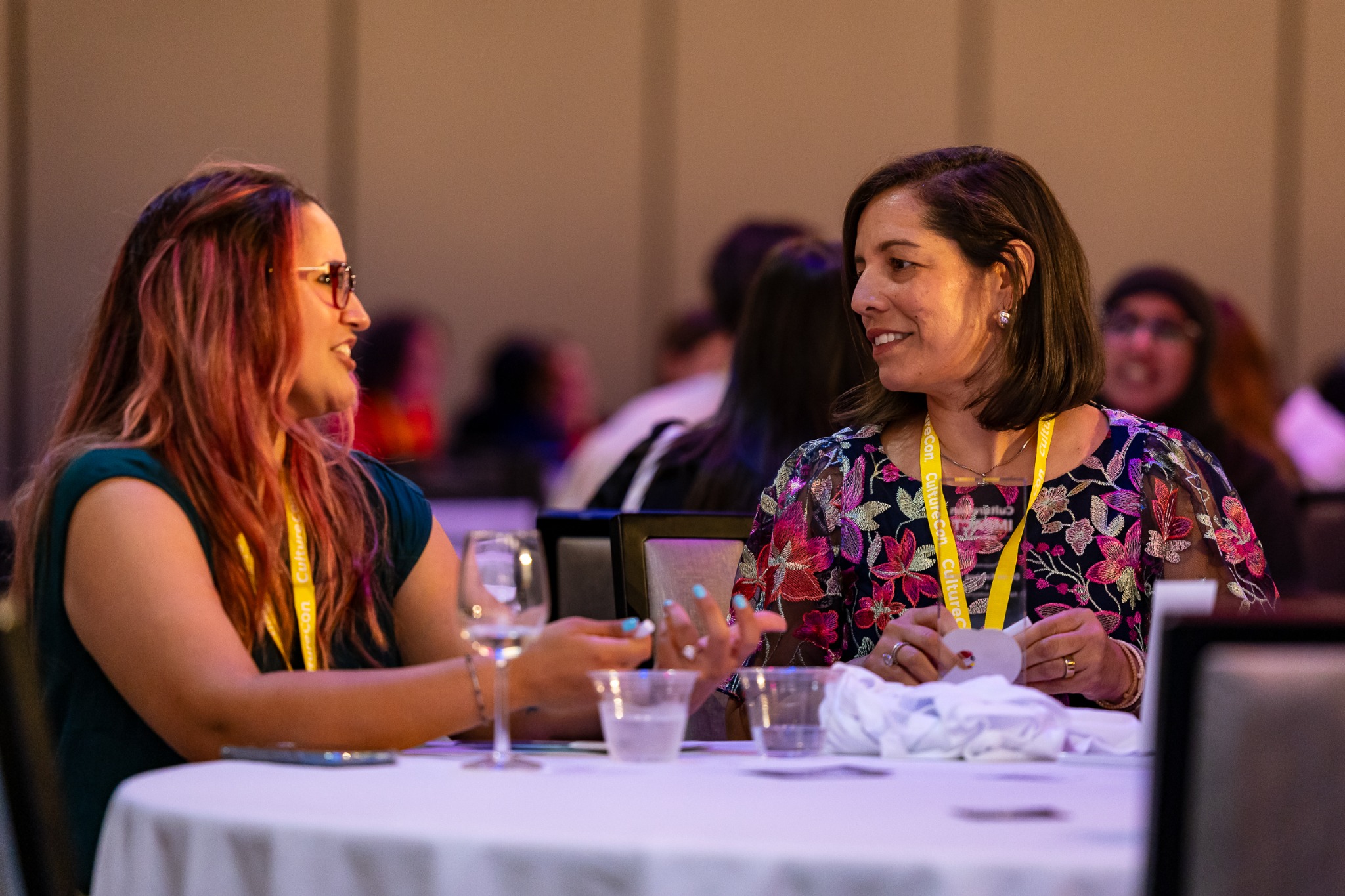 Two attendees in conversation at CultureCon.